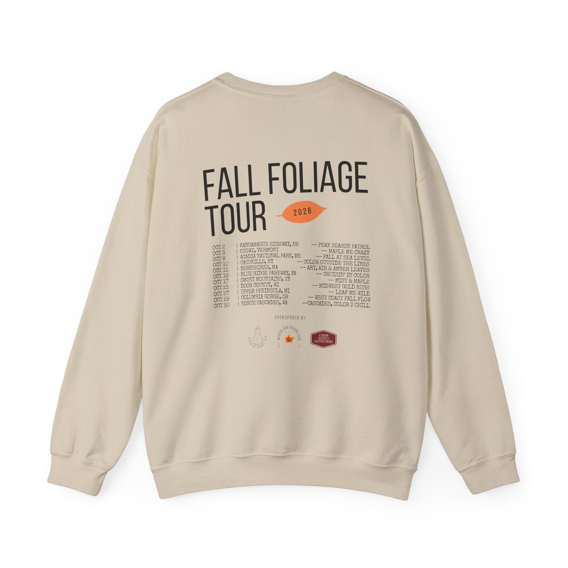 A beige crewneck sweatshirt shown from the back, featuring a graphic print that reads 'FALL FOLIAGE TOUR 2026' with a small orange leaf and a list of tour venues below.