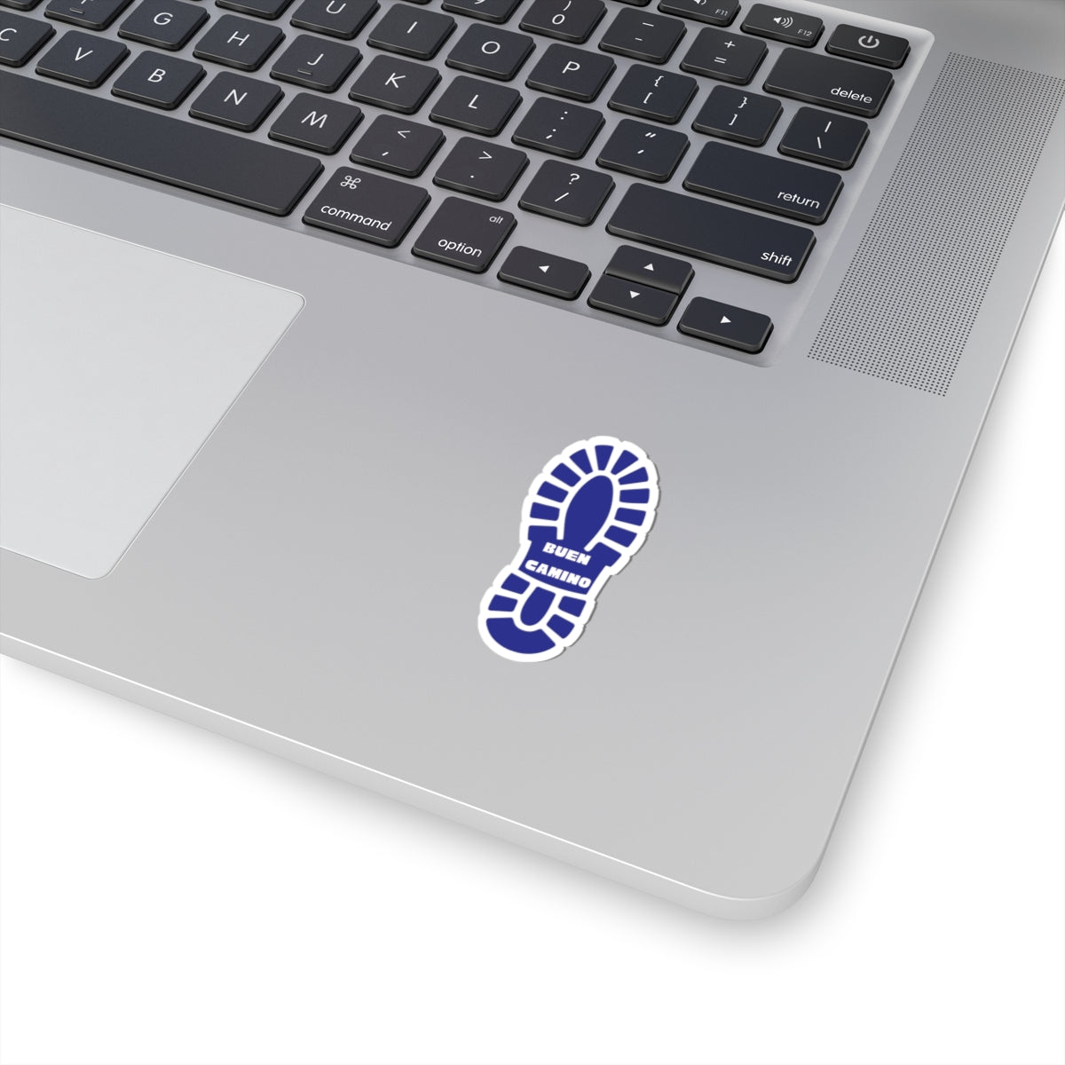 Blue sticker with a footprint design on a laptop