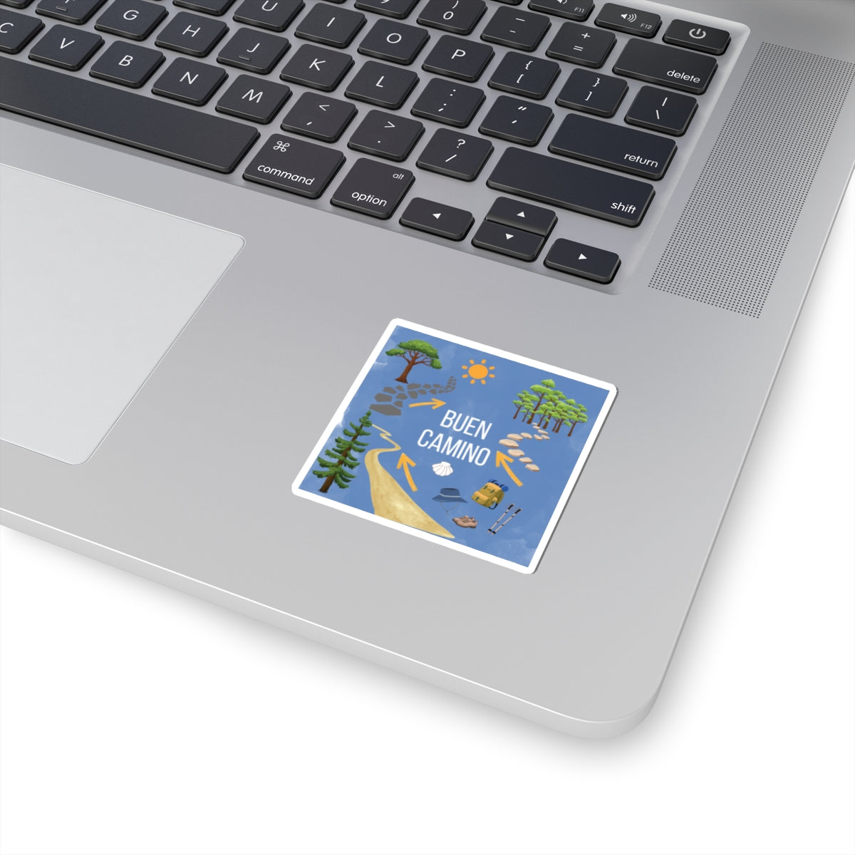 Laptop with a 'Buen Camino' sticker on the palm rest area