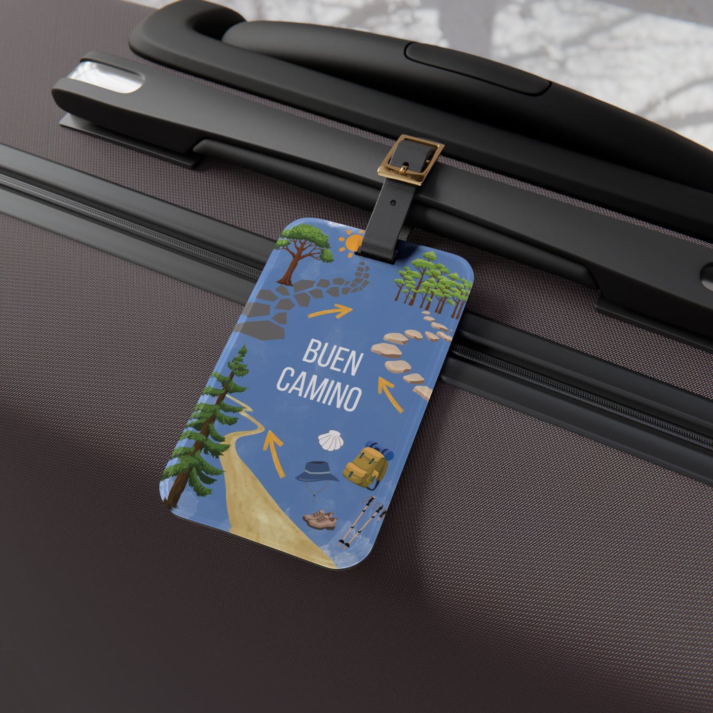 Luggage tag with travel-themed design attached to a suitcase