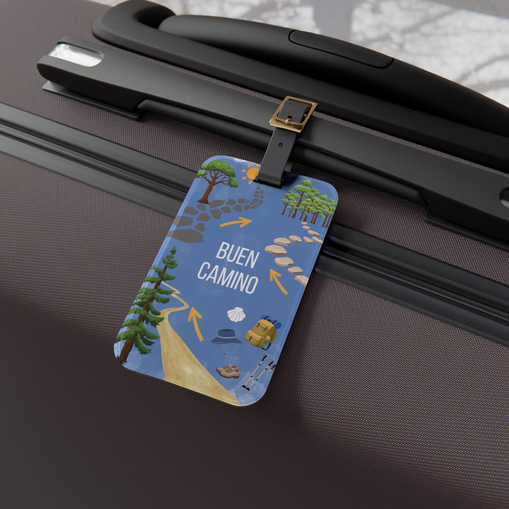 Luggage tag with travel-themed design attached to a suitcase
