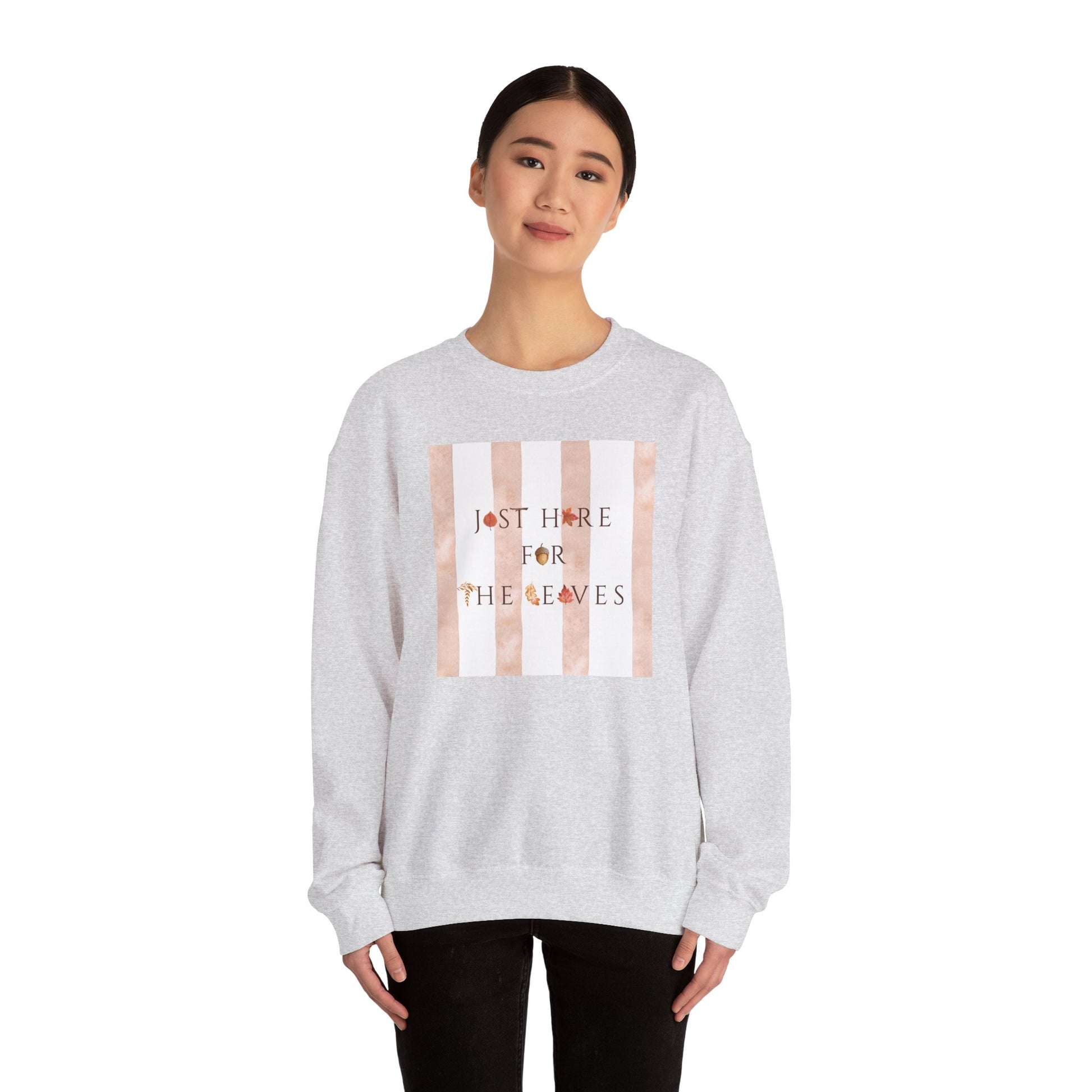 Person wearing a gray sweatshirt with 'Autumn Mood' and a pumpkin graphic on a white background