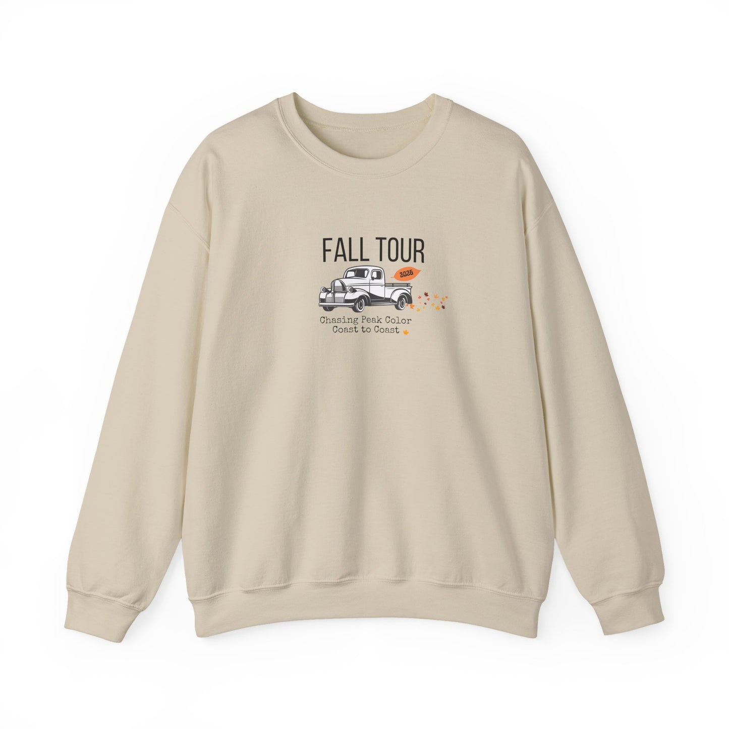 A beige crewneck sweatshirt with a graphic on the chest featuring a vintage pickup truck, the text 'FALL TOUR', and smaller text reading 'Scenic Peak Outdoor Quick No Snitch'.