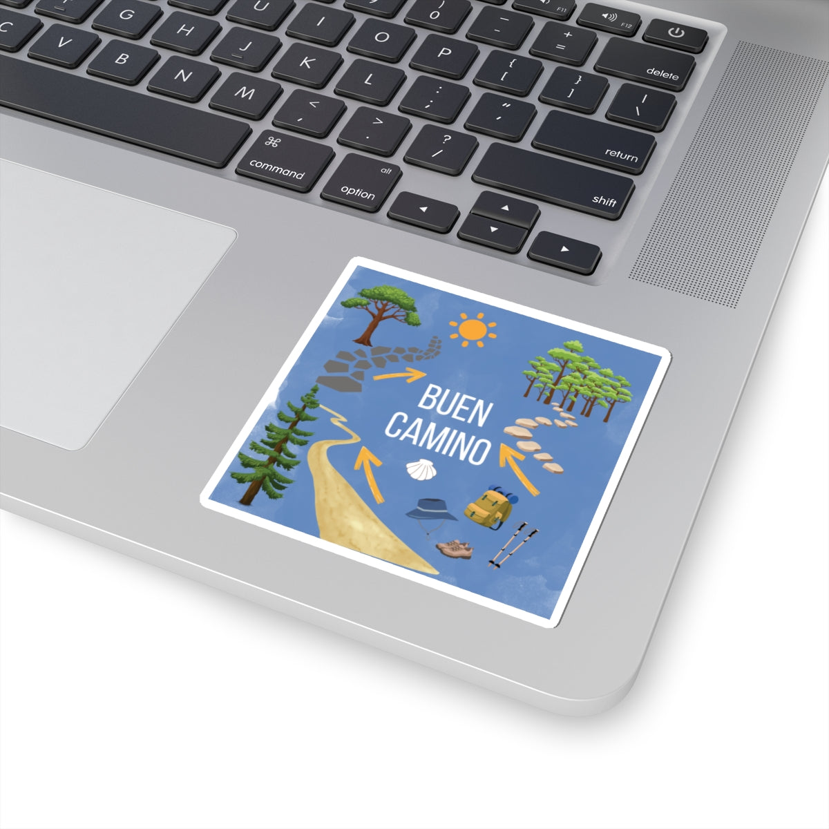 Laptop with a 'Buen Camino' sticker on the palm rest area