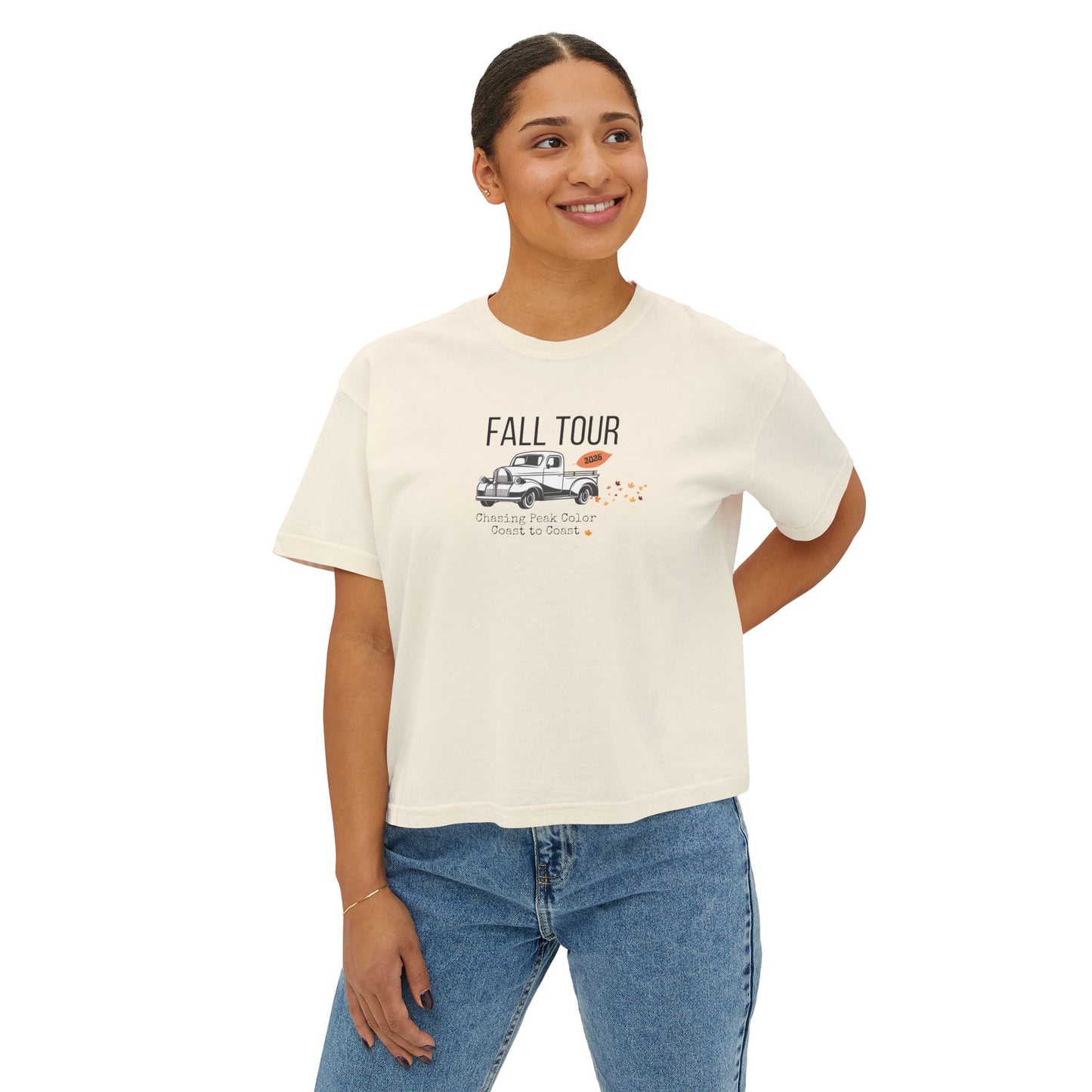 Woman wearing a white t-shirt with 'Fall Leaf Tour  text and a vintage truck and leaf graphic on a white background
