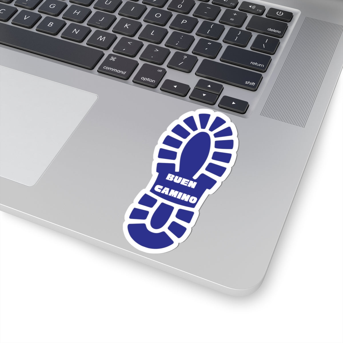 Blue footprints sticker with 'Buen Camino' text on a laptop