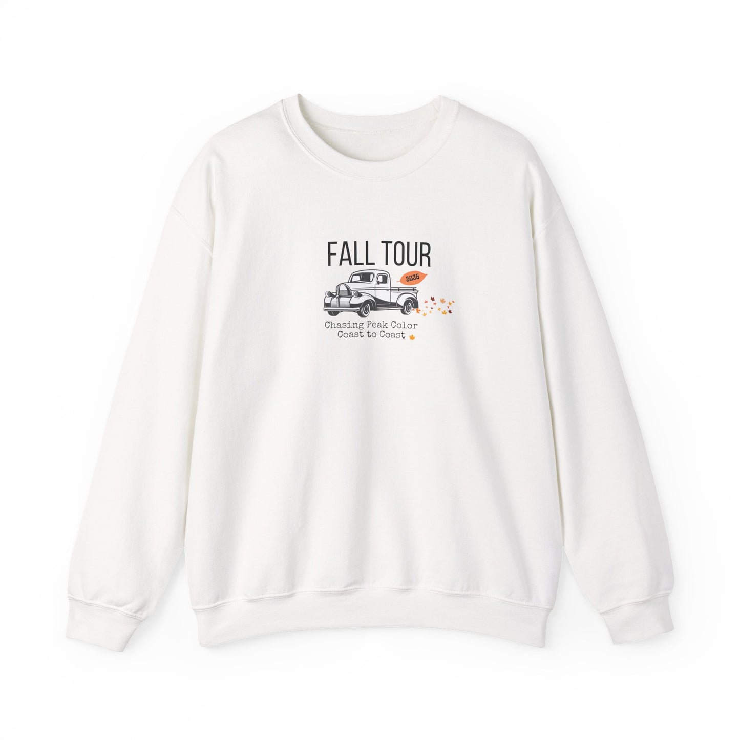 An off-white crewneck sweatshirt featuring a 'FALL TOUR' graphic on the chest with a vintage pickup truck and orange leaves, displayed on a clean white background.