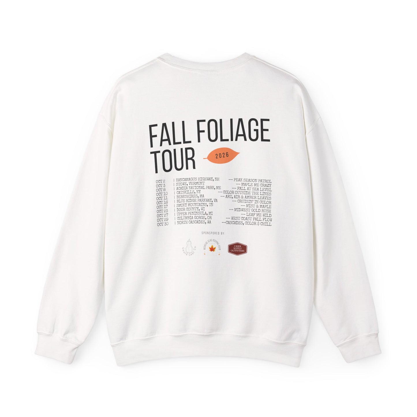 An off-white crewneck sweatshirt shown from the back, featuring a graphic print with the text 'FALL FOLIAGE TOUR 2018' and a list of venues and locations.