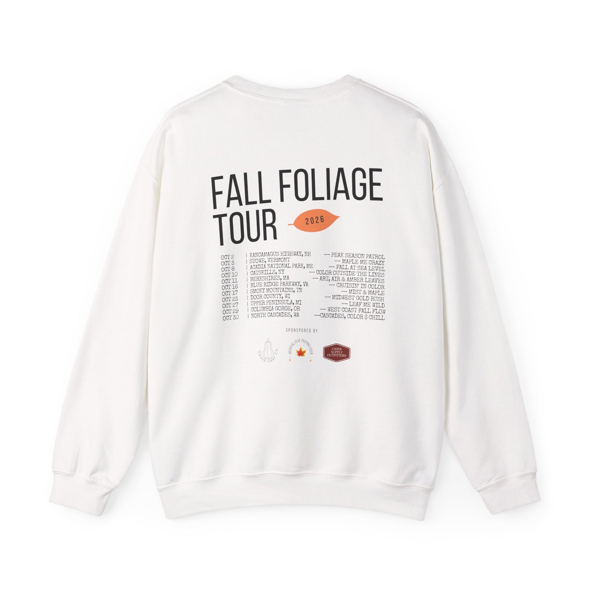 An off-white crewneck sweatshirt shown from the back, featuring a graphic print with the text 'FALL FOLIAGE TOUR 2018' and a list of venues and locations.