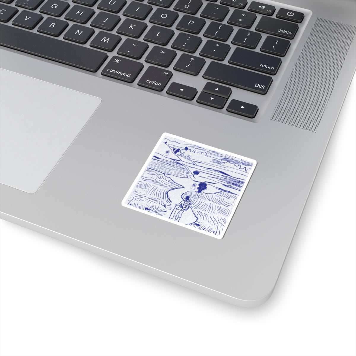 Laptop with a motivational sticker on the palm rest area
