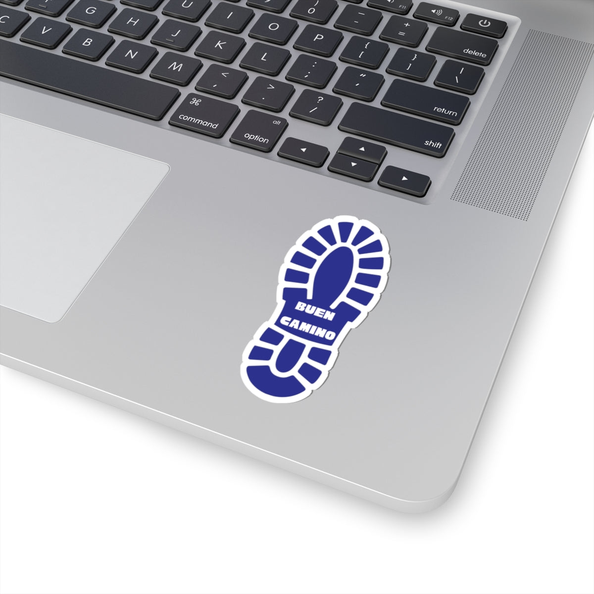 Laptop with a blue and white sticker on the palm rest area
