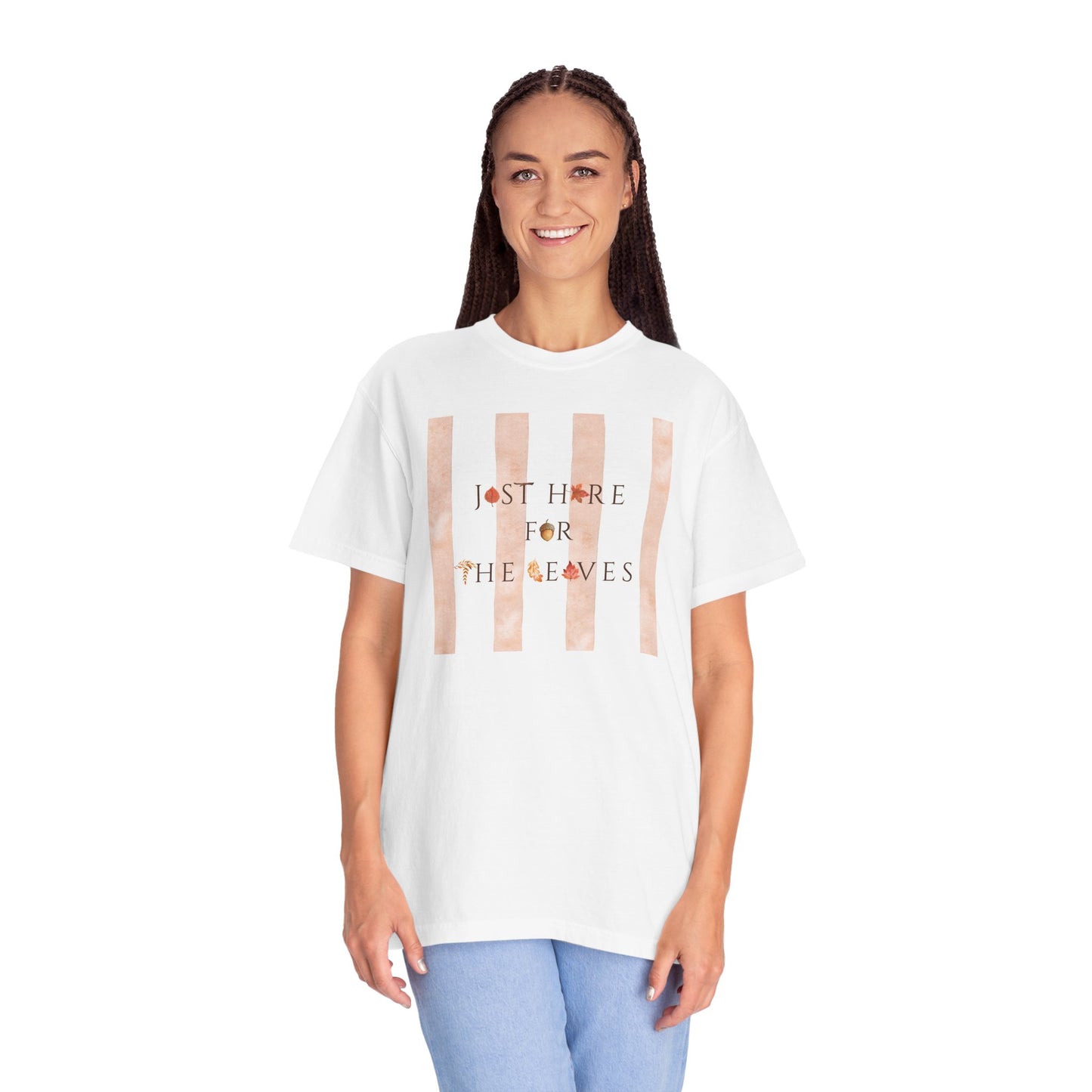 Person wearing a white t-shirt with fall leaves text and graphic on a white background