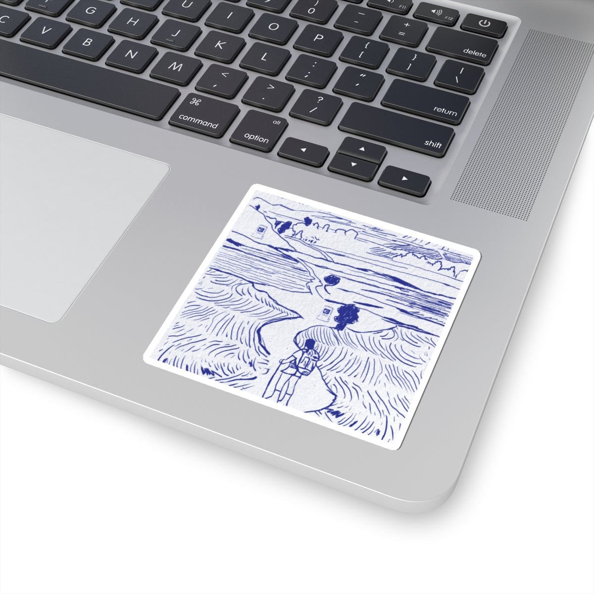 Laptop with a blue and white sticker on the palm rest area