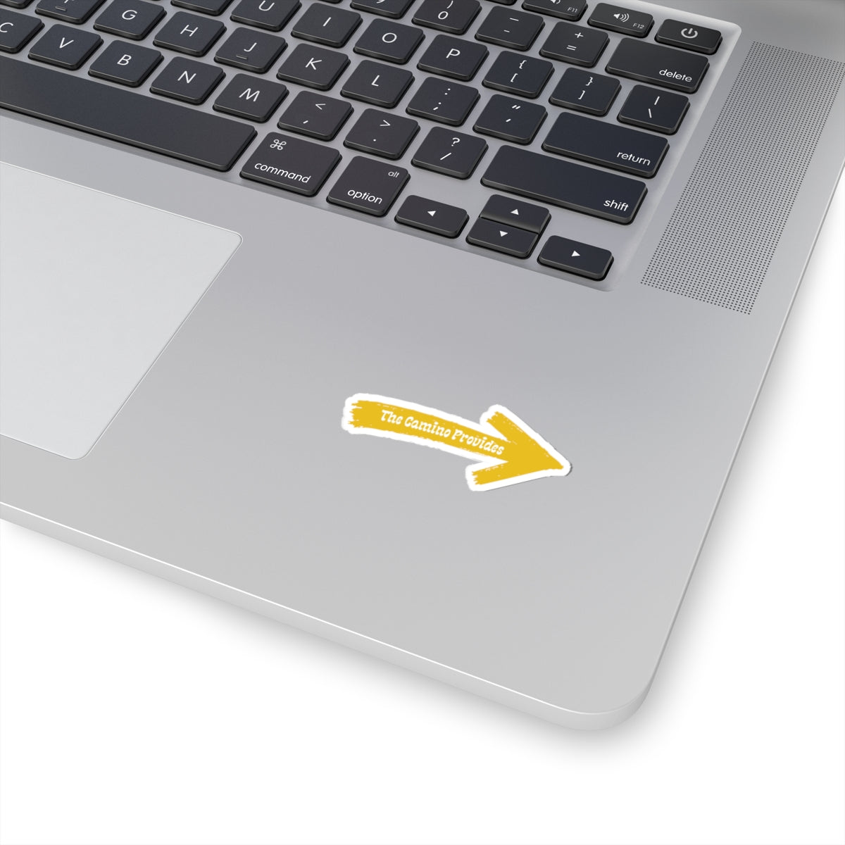 Laptop with a sticker indicating 'The Camino provedes' on a white background