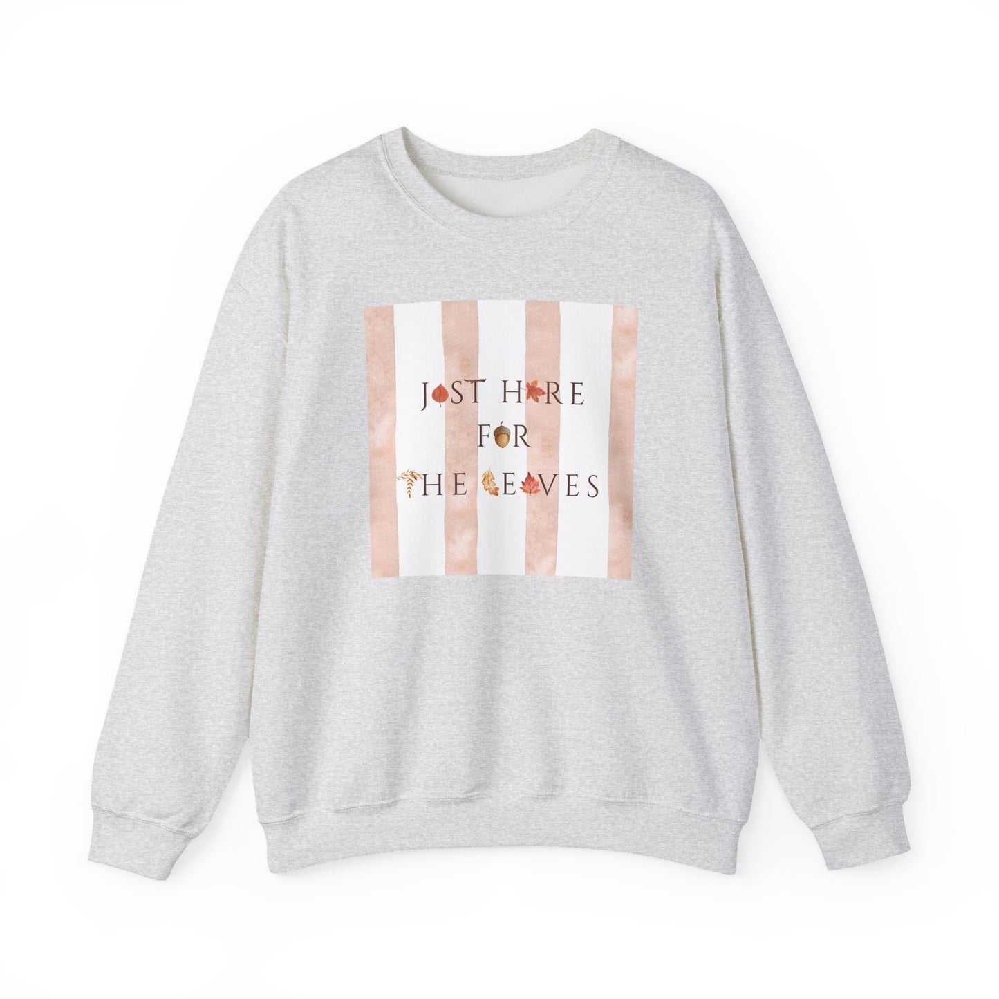A light heather gray crewneck sweatshirt featuring a square chest graphic with vertical peach and white stripes and the text 'JUST HERE FOR THE LEAVES' in a dark font with small leaf accents.