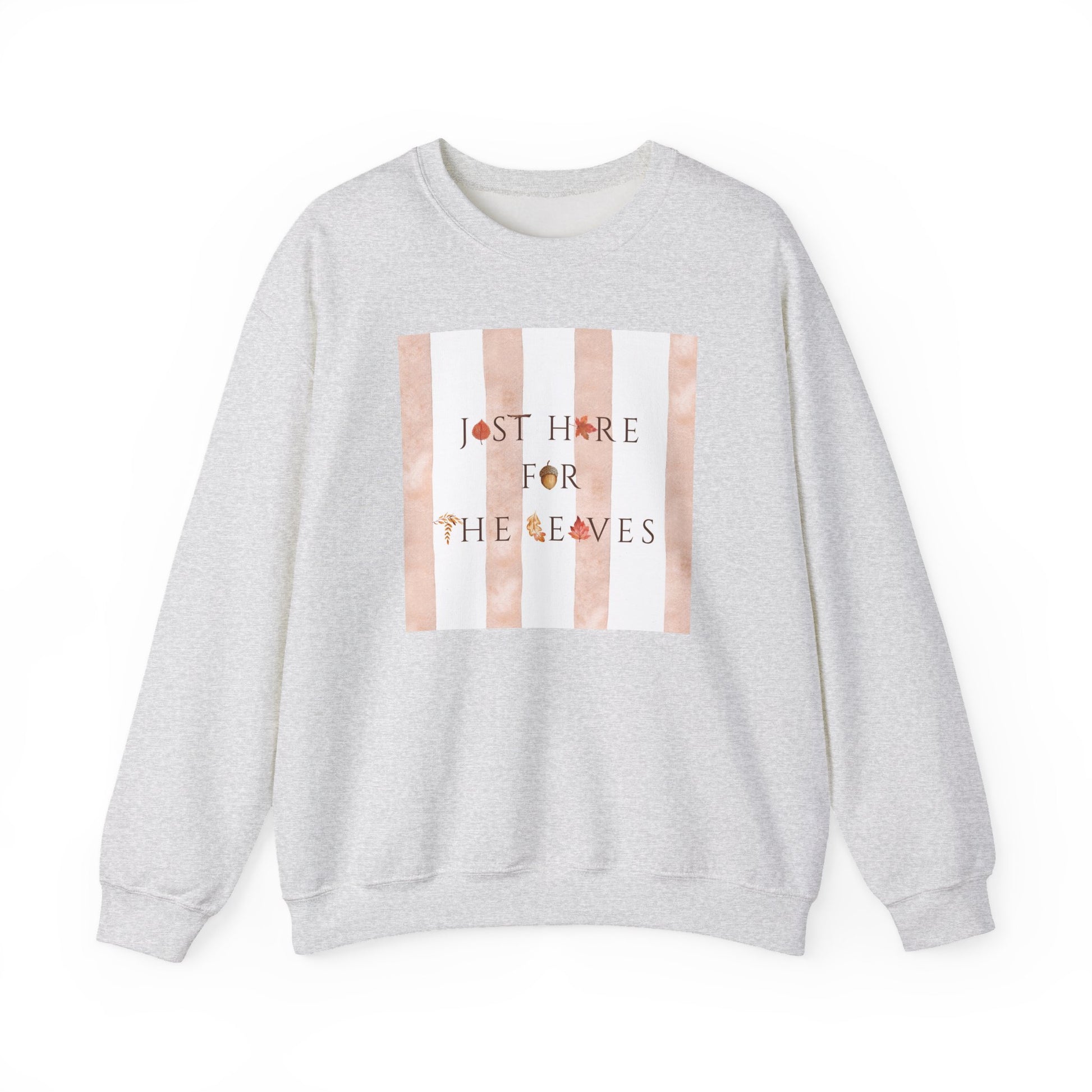 A light heather gray crewneck sweatshirt featuring a square chest graphic with vertical peach and white stripes and the text 'JUST HERE FOR THE LEAVES' in a dark font with small leaf accents.